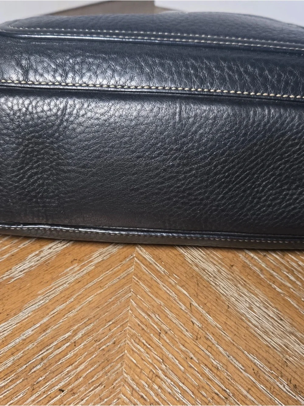 Coach Black Pebbled leather Chelsea turnlock top.